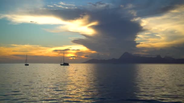 Moorea sunset view from Tahiti a Polynesian paradise yachts in tropical Island lagoon South Pacific ocean - Footage, Video