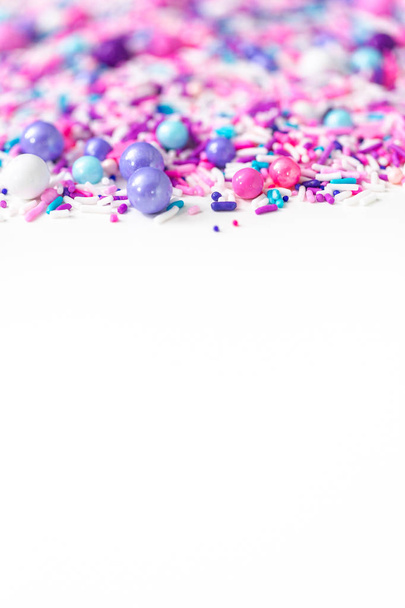 Colorful purple sprinkle blend on a white background. - Photo, Image