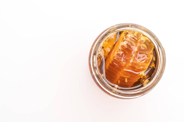 honey jar isolated on white background - 写真・画像