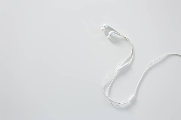 Modern portable audio earphones isolated  - Foto, Bild