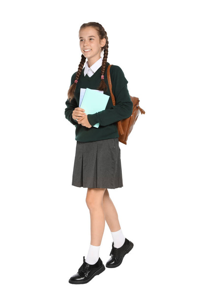 Teenage girl in stylish school uniform on white background - Φωτογραφία, εικόνα