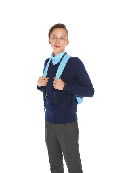 Teenage boy in stylish school uniform on white background - 写真・画像