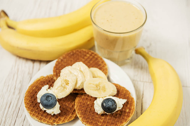 Wafers with blueberries and cheese and banana fresh. Different fruit and delicious breakfast. - Foto, Imagen