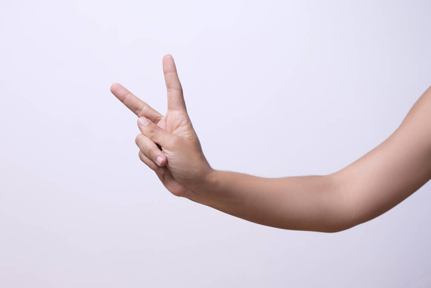Closeup of persons hand showing gesture over white background - Foto, Imagem