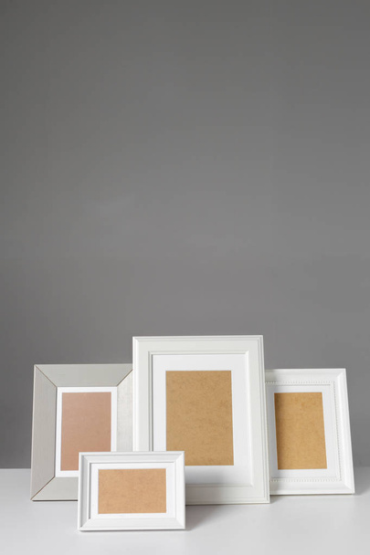 Blank photo frames on the table - Valokuva, kuva