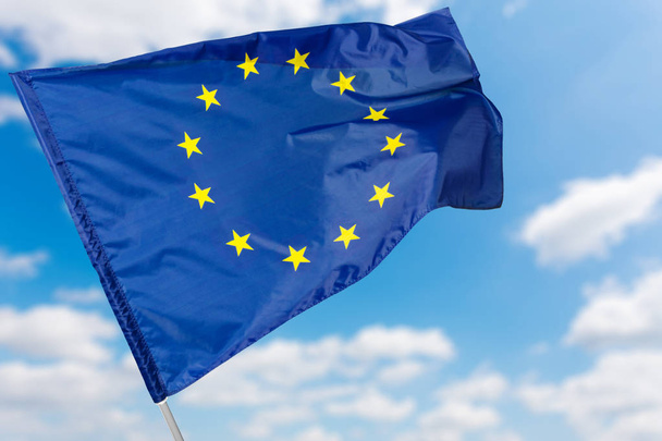 european flag waving on blue sky background - Fotó, kép