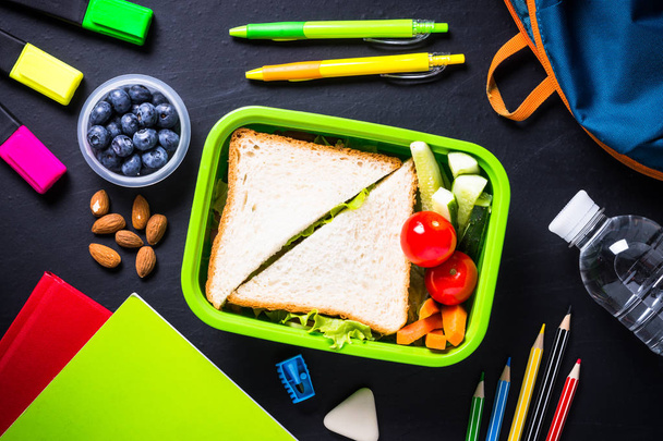 School lunch box, stationery and backpack. - 写真・画像