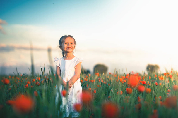 New Era Concept With Happy Kids And People. Happy Society. Successful Community. Little Girl Outdoor At Poppy Field Hold Moms Hand. Autumn, Summer Season. Happy Family Values. Childrens Health Care - Фото, зображення