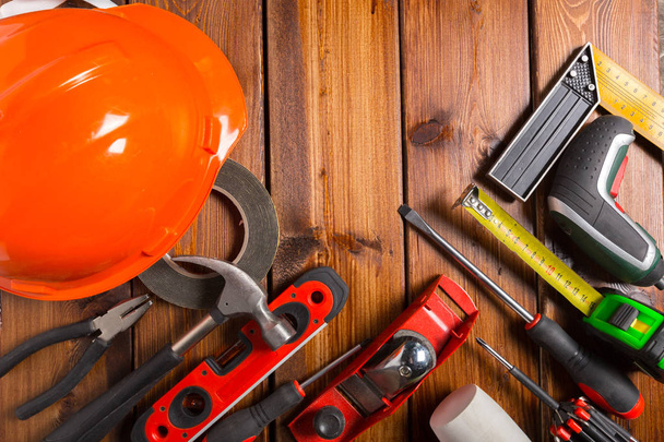 Assorted work tools on wooden background - Foto, Imagen