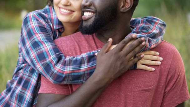 Cheerful couple tightly hugging posing to camera, healthy smiling, wellness - Fotó, kép