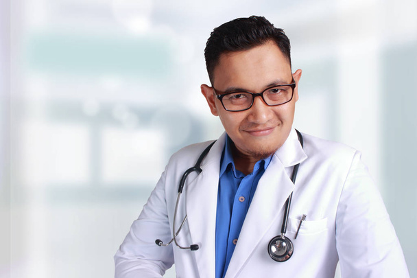 A Young Asian doctor with eyeglass Smiling Confident posing and looking at camera - Valokuva, kuva