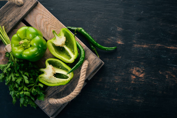 Fresh green pepper and chili pepper. Organic food. Top view. Free space for text. - 写真・画像