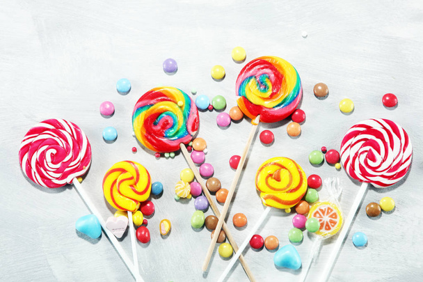 candies with jelly and sugar. colorful array of different childs sweets and treats. - Photo, Image