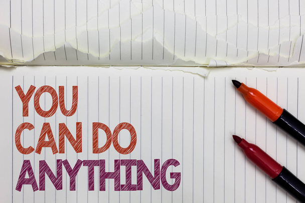 Text sign showing You Can Do Anything. Conceptual photo Motivation for doing something Believe in yourself White torn page written some letters beside laid two red marker - Foto, afbeelding