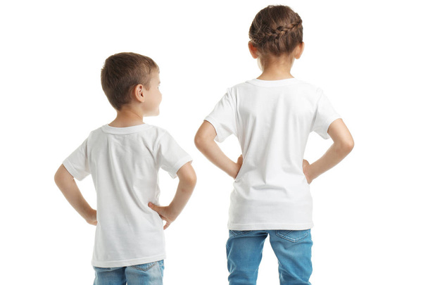 Little kids in t-shirts on white background. Mockup for design - Фото, изображение