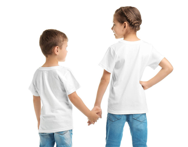 Little kids in t-shirts on white background. Mockup for design - Photo, image