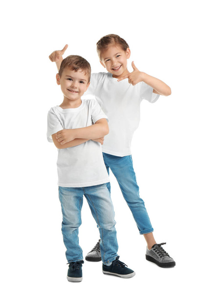 Little kids in t-shirts on white background. Mockup for design - Photo, image