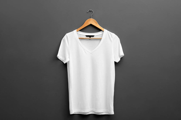 Hanger with blank t-shirt on grey background. Mockup for design - Fotoğraf, Görsel