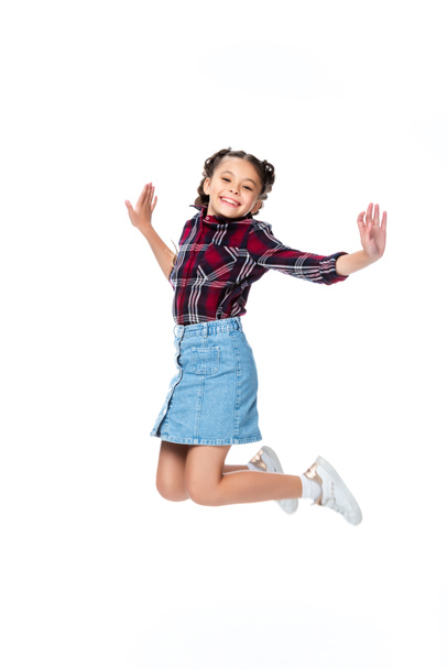 happy schoolchild jumping isolated on white - Photo, Image