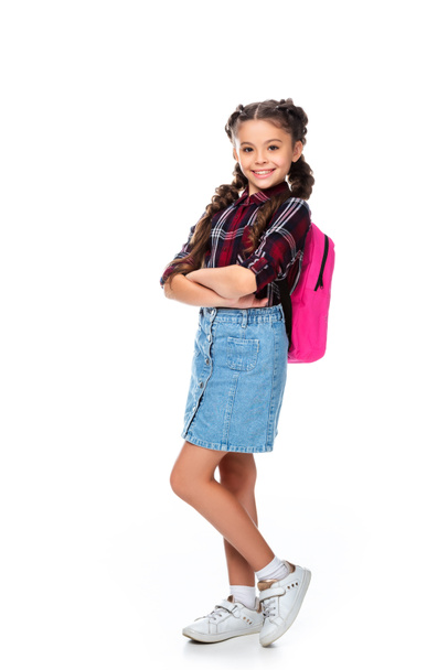 schoolchild with pink backpack standing with crossed arms isolated on white - Foto, Imagen