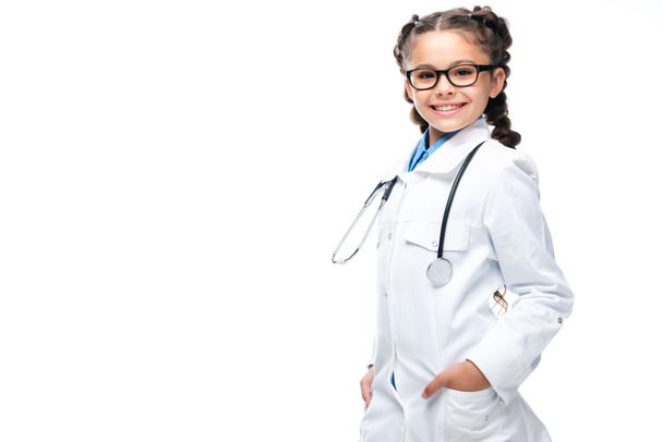 smiling schoolchild in white coat looking at camera isolated on white - Photo, Image