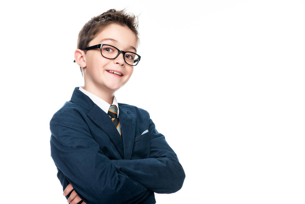 smiling schoolboy in businessman suit looking at camera isolated on white - Fotoğraf, Görsel