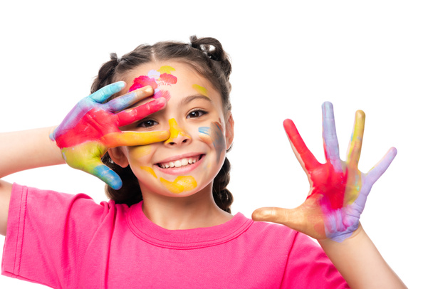 happy schoolchild showing painted hands isolated on white  - Fotó, kép