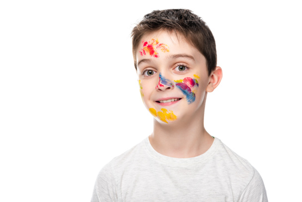 schoolboy with paints on face looking at camera isolated on white - Φωτογραφία, εικόνα