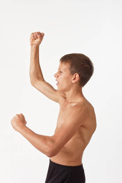 teenager with muscles. emotions of the winner - Photo, Image