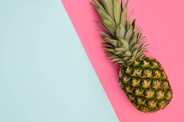 Pineapple fruit on bright pink background minimal summer food concept - Photo, Image