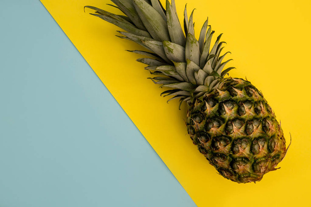 Pineapple fruit on bright yellow background minimal summer food concept - Photo, Image