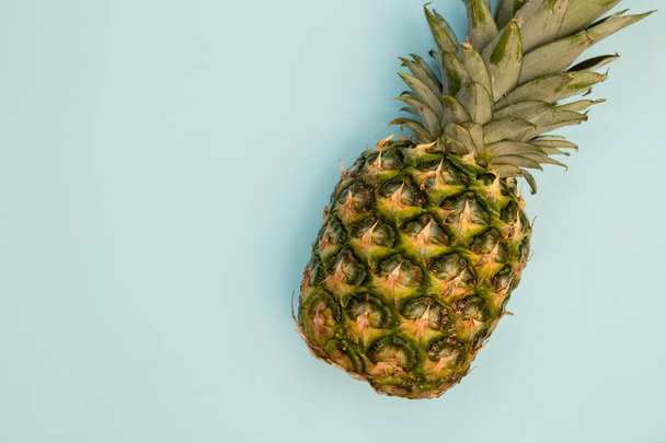 Pineapple fruit on bright blue background minimal food - Photo, Image
