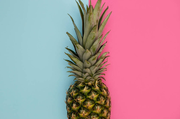Pineapple fruit on bright pink background minimal summer food concept - Photo, image
