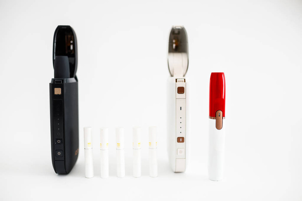 New technology of electronic cigarettes system. Electronic cigarettes, technology cigarette, electronic cigarette. Tobacco system IQOS. - Foto, imagen