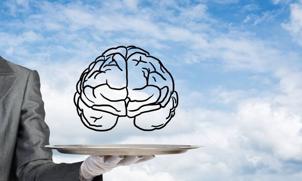 Cropped image of waitress's hand in white glove presenting sketched brains on metal tray with cloudy skyscape on background. 3D rendering. - Photo, Image