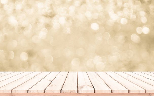 Wood table or wood floor with abstract gold bokeh background for product display  - Photo, Image
