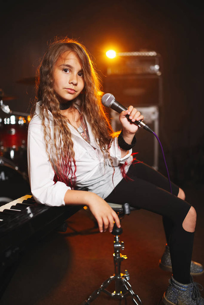 beautiful girl singing in recording studio - 写真・画像
