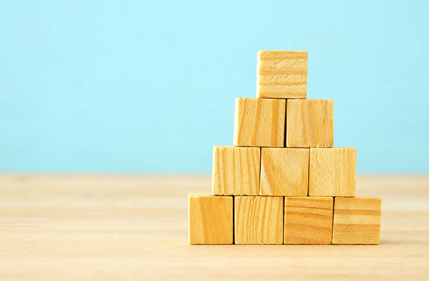 image of wooden blocks over table ,building a strong team, human resources and management concept - Valokuva, kuva