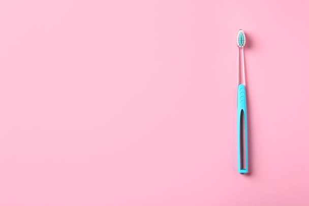 Manual toothbrush on color background. Dental care - Foto, Imagem