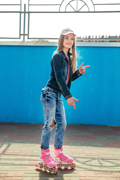 Young girl on rollerblades in the city - Photo, Image