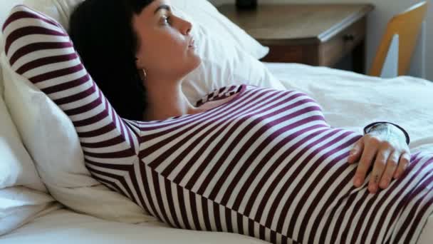 Beautiful woman relaxing in bedroom at home 4k - Felvétel, videó