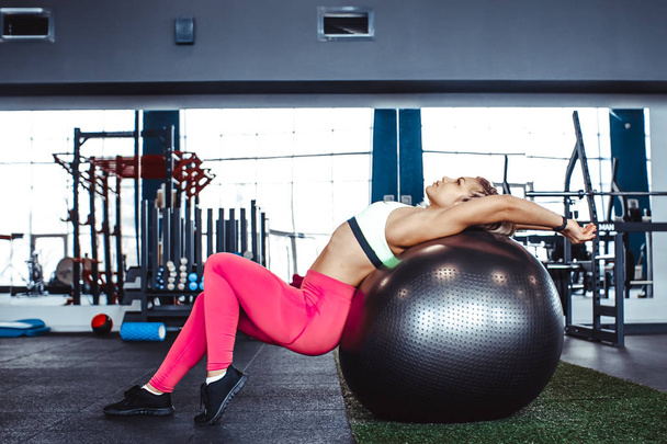 girl sitting on ball for exercise - Photo, Image