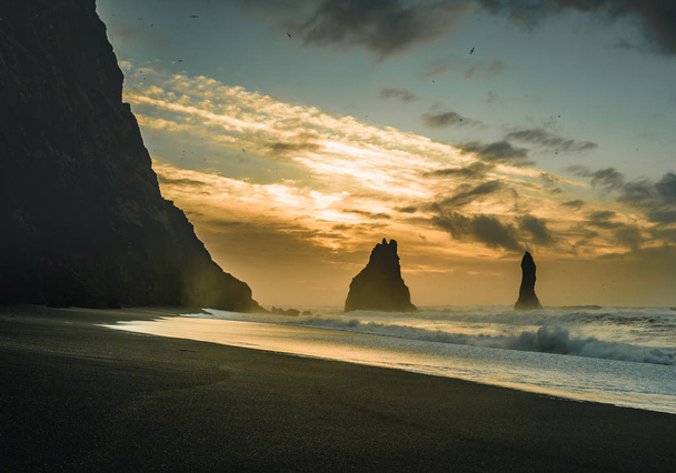 Sunrise at famous Black Sand Beach Reynisfjara in Iceland. Windy Morning. Ocean Waves. Colorful Sky. Morning Sunset. - Photo, Image