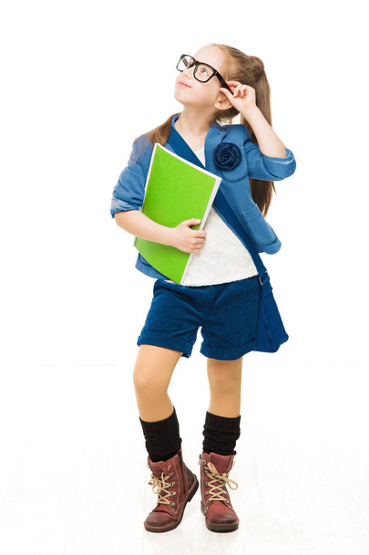 School Child, Girl in Glasses Holding Books and Looking Up, Happy Kid Isolated over White Background - 写真・画像