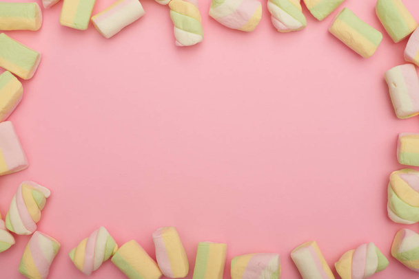 Frame made of marshmallows on pink flatlay - Photo, Image