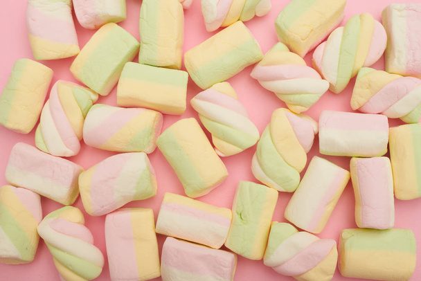 Colorful marshmallows placing on pink flatlay - Photo, Image