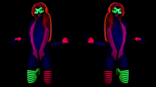fantastic video of sexy cyber raver dancing girls filmed in fluorescent clothing under UV black light - Footage, Video