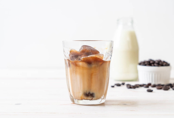 coffee ice cubes with milk on wood table - Foto, immagini