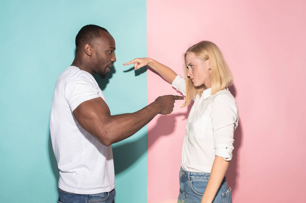 Man and woman posing at studio during quarrel - Foto, afbeelding