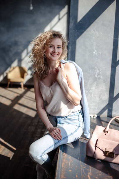 Close-up portrait of sweet blonde woman in a casual jeans clothes, fashion beauty photo - 写真・画像